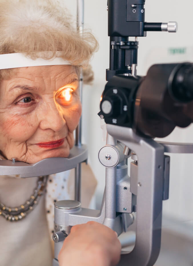 senior checking eyes