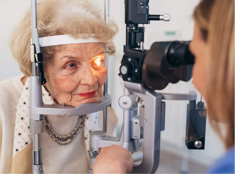 senior checking eyes