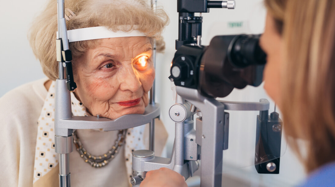 senior checking eyes